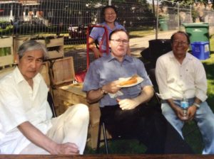 Stephen enjoying some food with local members of the Vietnamese community